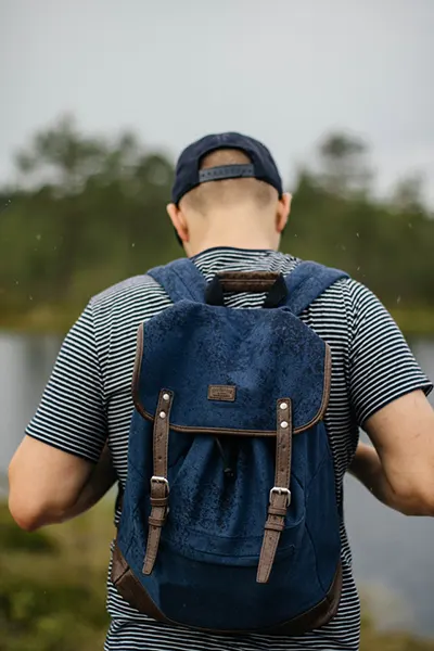 A Man with a bong in his backpack