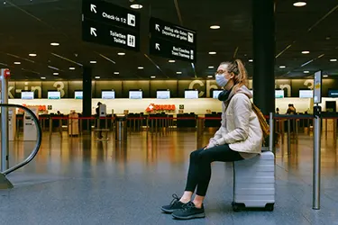 girl wear shoes during the airport security check